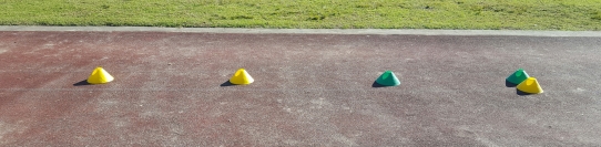 An image showing how to set up coloured cones to provide a visual cue for young athletes learning the triple jump.